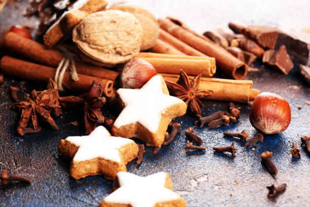 istock Baking christmas cookies. Typical cinnamon stars bakery with spices. xmas decoration on table 1182511642