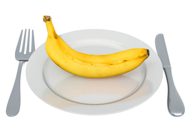 istock Banana on plate with fork and knife, 3D rendering isolated on white background 1182511825
