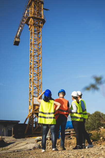 istock Three construction workers having meeting,stock photo 1182512757
