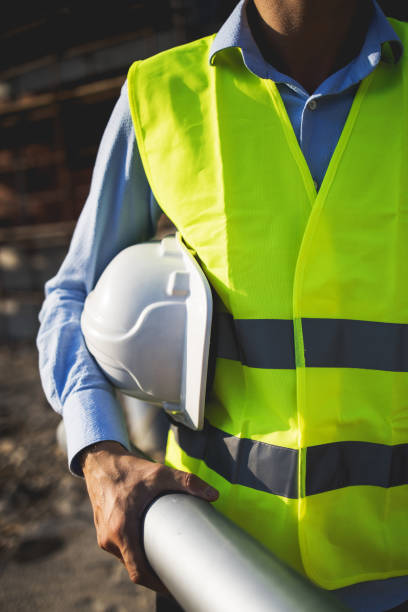 istock Three construction workers having meeting,stock photo 1182512827