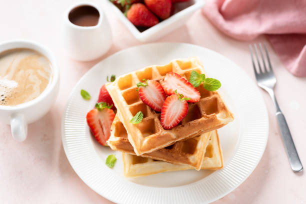 istock Belgian waffles with strawberries for breakfast 1182513042