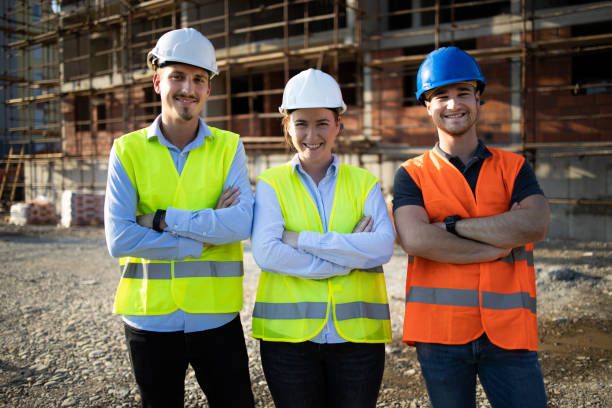 istock Three construction workers having meeting,stock photo 1182513083