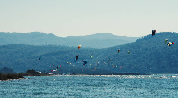 istock People kite surfing in the sea 1182513212