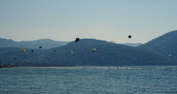 istock People kite surfing in the sea 1182513730