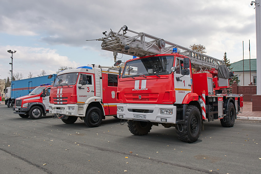 Saransk, Russia - October 04, 2019: Fire trucks of Ministry of Emergency Situations of the Russian Federation (EMERCOM) in a row at Soviet Square in Saransk.