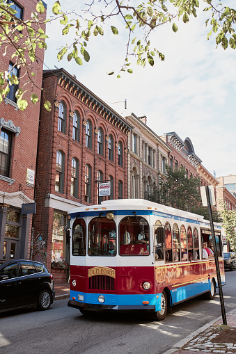 Portland, Maine - September 26th, 2019: Portland Mainely bus carrying passengers in historic Old Port district of Portland