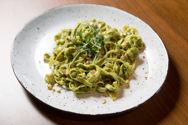 istock Tagliatelle pasta with pistachio and sauce pesto 1182515437