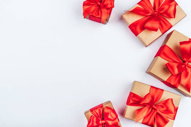 istock Frame of cardboard gift boxes with red bows. 1182515569
