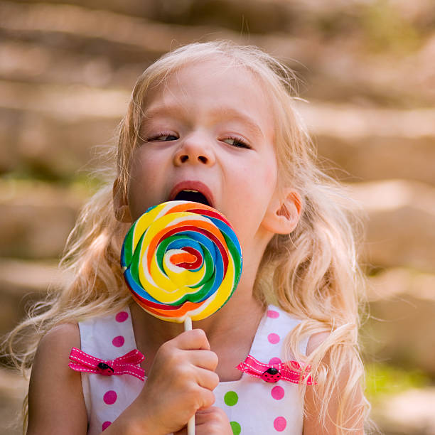 istock Little girl with a Lollipop 118251618