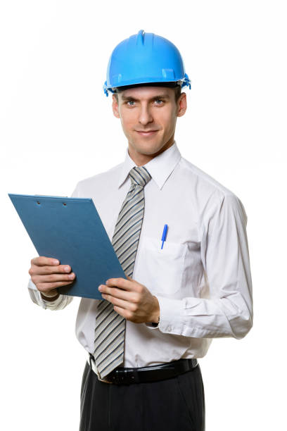 istock The young engineer holds a clipboard 1182518892