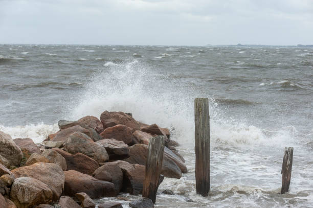 istock Storm wave breaking over jetty on Sconticut Neck in Fairhaven, Massachusetts 1182519929