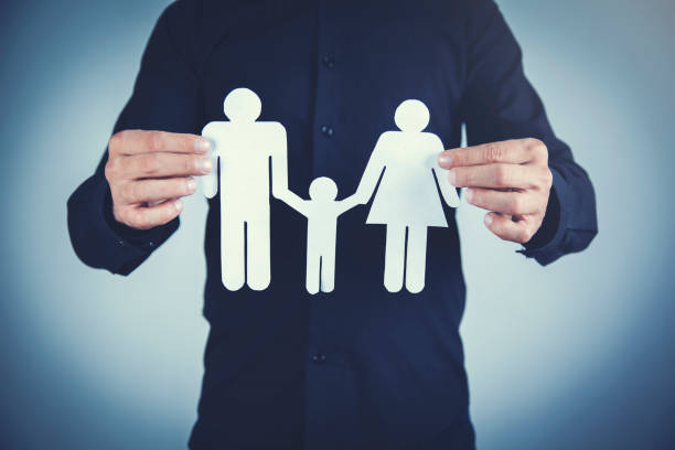 istock man hand paper family 1182521397