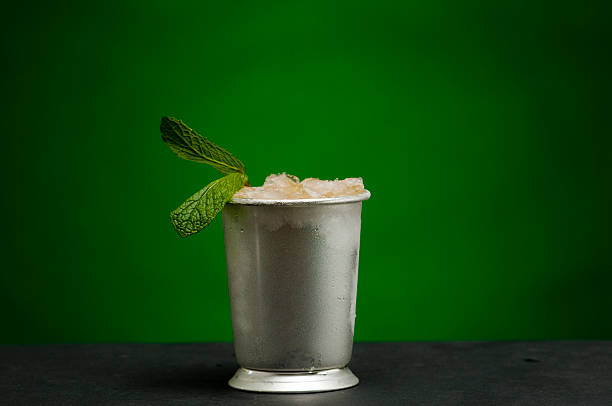 Mint Julep A Mint Julep cocktail served in a traditional mint julep glass mint julep photos stock pictures, royalty-free photos & images