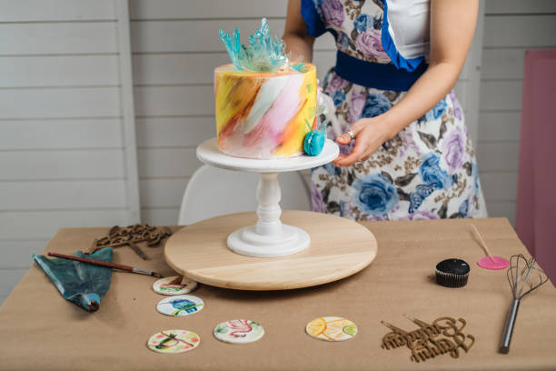 istock Woman enjoying cake making 1182521504