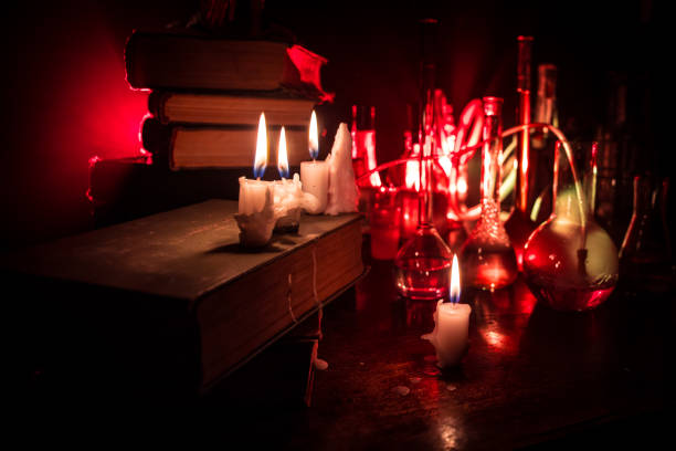 istock Halloween still-life background with different elements on dark toned foggy background. Selective focus 1182521728