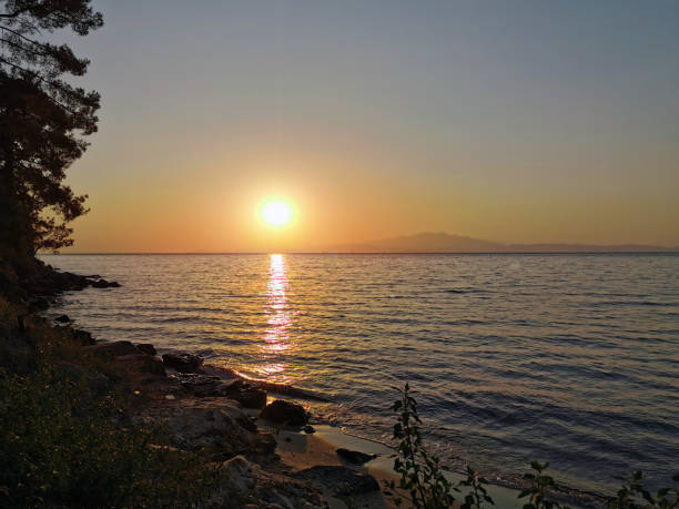 istock Sunset sea horizon sky clouds sunset landscape 1182525429