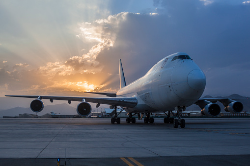 Cargo Airplane On Airport at sunset