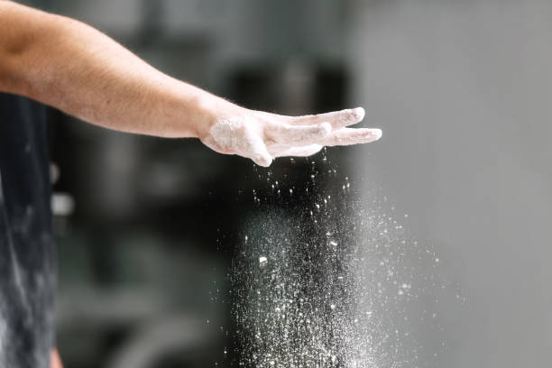 istock Pastry chef, pouring flour in confectionery kitchen. 1182534066