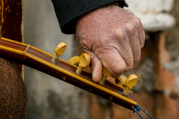 man whose skin made a thatch chord with his dry hand