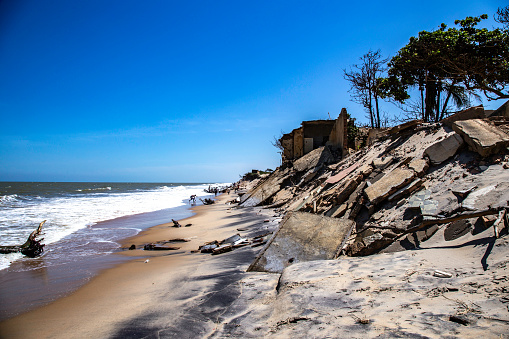 Ruins of houses by the beach in Atafona, Rio de Janeiro, Brazil - Global Warming