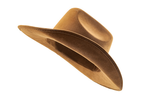 Rodeo horse rider, wild west culture, Americana and american country music concept theme with side view of a brown leather cowboy hat isolated on white background with clip path cut out
