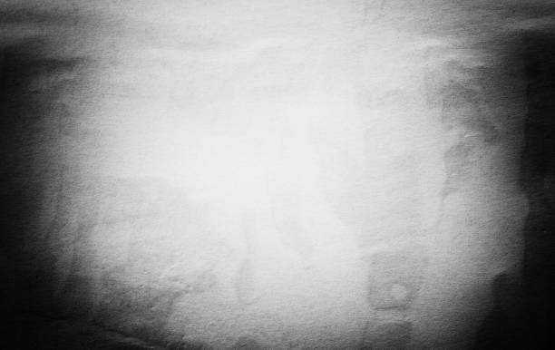 istock Blank white black old ripped torn paper crumpled creased posters grunge textures backdrop backgrounds placard 1182540294