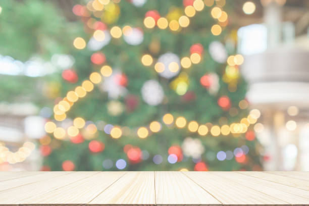 istock Empty wood table top with Abstract blur Christmas tree with decoration bokeh light background for product display 1182550006