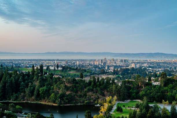 Sunrise over the San Francisco Bay Area The sun rises over San Francisco, Oakland, and the rest of the bay, while filling the cloudy sky with vibrant color. west marin stock pictures, royalty-free photos & images