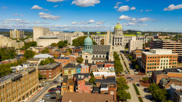 Harrisburg state capital of Pennsylvania along on the Susquehanna River Early Morning light hits the buildings and downtown city center area in Pennsylvania state capital at Harrisburg pennsylvania stock pictures, royalty-free photos & images