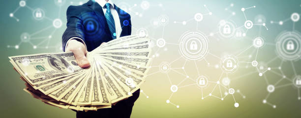 istock Cyber security theme with business man with cash 1182560774