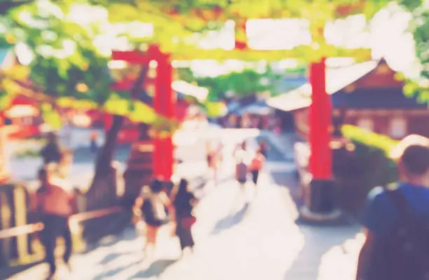 Abstract blurred tourists visit Fushimi Inari shrine in Kyoto Japan