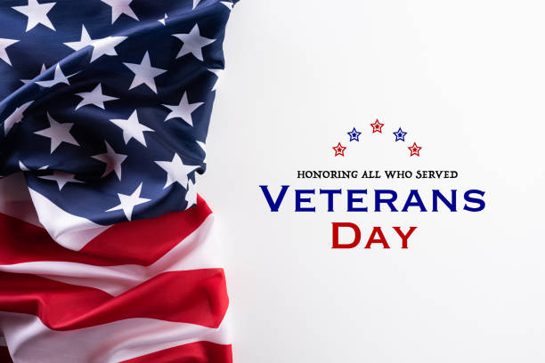 istock Happy Veterans Day. American flags against a white background. 1182561943