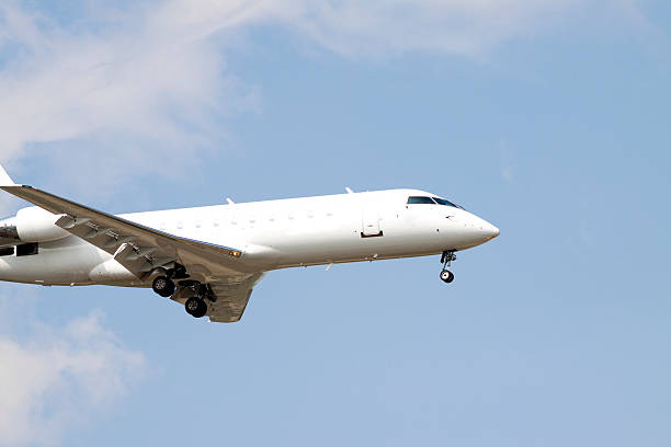 istock Airplane Flying in a Blue Sky, Side View 118256667