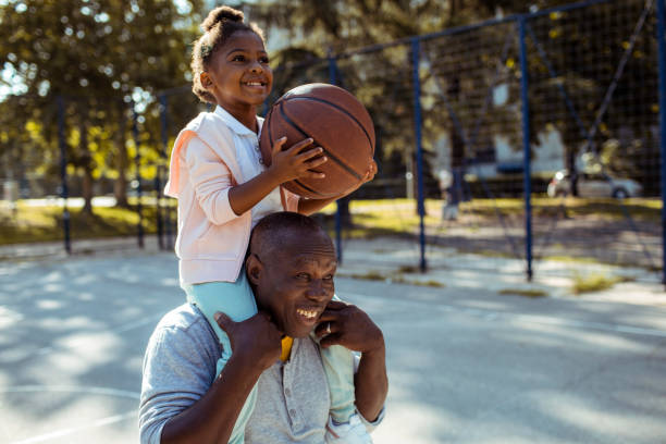 grandfather and granddaughter - basketball playing ball african descent imagens e fotografias de stock