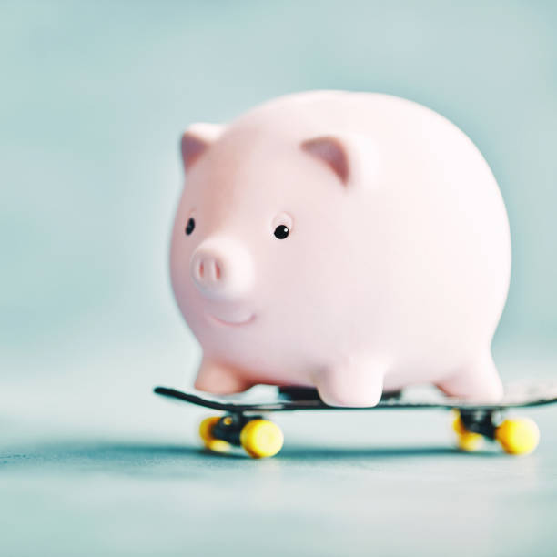 Little pink piggy riding on a skateboard
