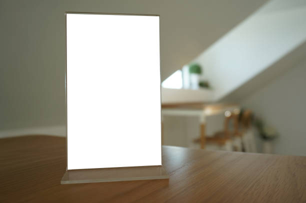 istock Menu frame standing on wood table in Bar restaurant cafe. space for text marketing promotion. 1182572944