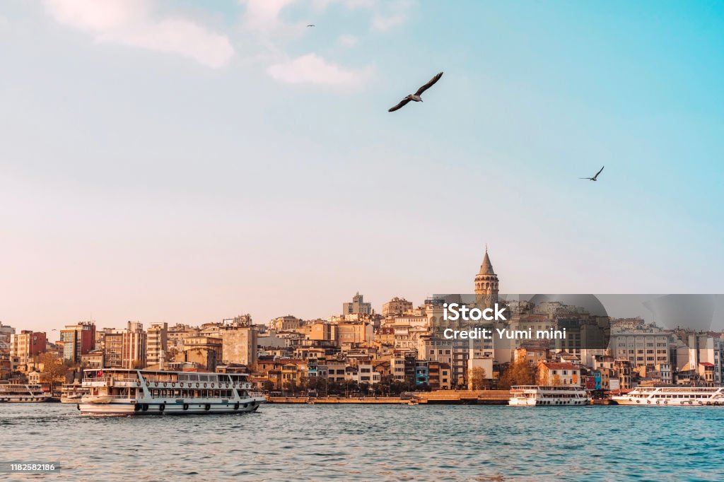 View of Istanbul cityscape Galata Tower with floating tourist boats in Bosphorus ,Istanbul Turkey Istanbul Stock Photo