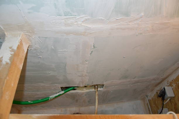 istock Wall painting in the interior with white water-based paint 1182584975