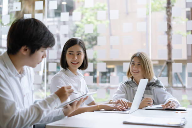 istock Young startup business colleagues discussing work together in modern start up office. 1182586114