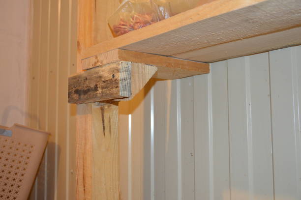 istock Making a shelf rack from lumber of long boards 1182586273
