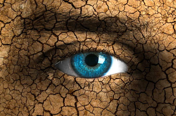 istock Human face painted with cracked ground 1182587093