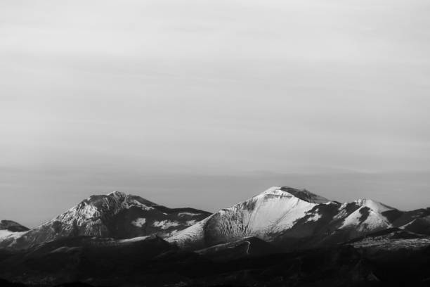 istock Mountain top covered by snow 1182591827