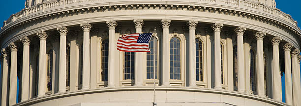 US Flag at Capitol US Flag at the Capitol Building dome in Washington DC house of representatives photos stock pictures, royalty-free photos & images