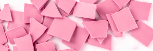 istock A panorama of ruby chocolate, shot from the top on a white marble background 1182596947