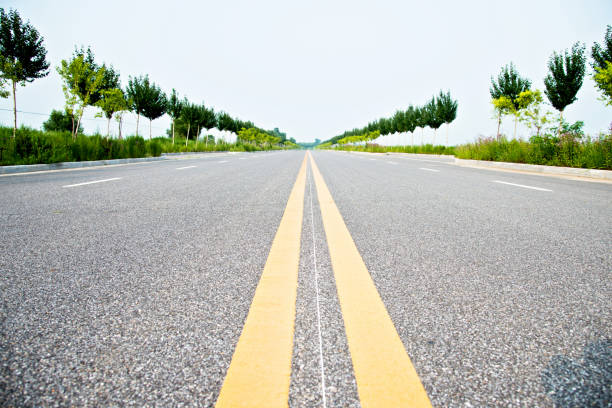 istock Double yellow lines on a road 1182598083