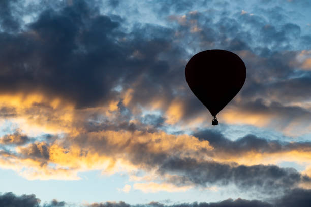 istock Hot air balloon over blue sky. 1182598780