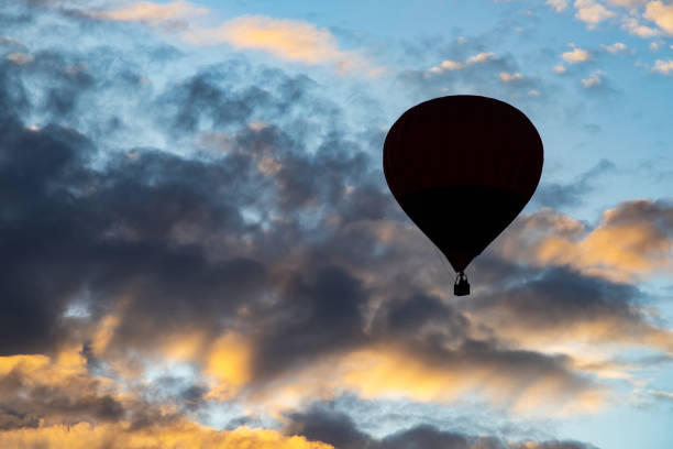 istock Hot air balloon over blue sky. 1182598993