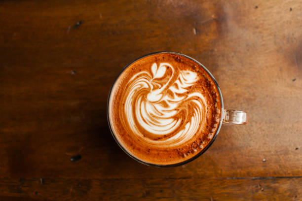 istock Hot latte art coffee top view on wood table 1182599002