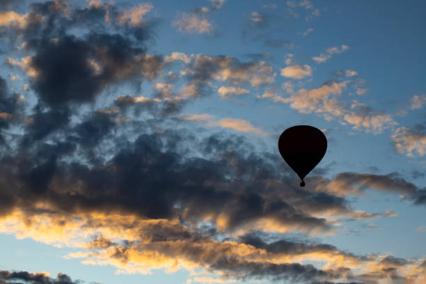 istock Hot air balloon over blue sky. 1182599070