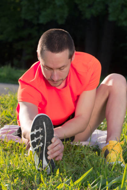 istock Man stretching after exercise in the park. 1182600629